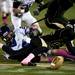 Pioneer sophomore wide receiver Cameron Cole fumbles the ball on a kickoff in the second half against Huron on Friday. Daniel Brenner I AnnArbor.com